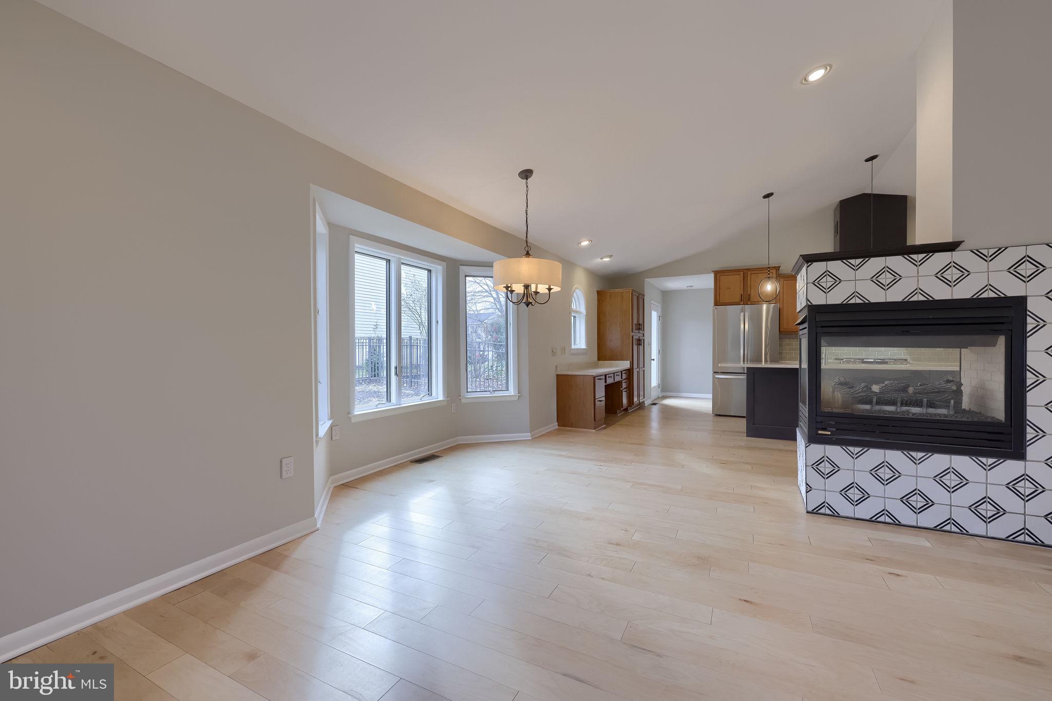 421 Longmeadow Road Lancaster, PA 17601 - Photo 15 of 44 a view of an empty room with a fireplace and a window