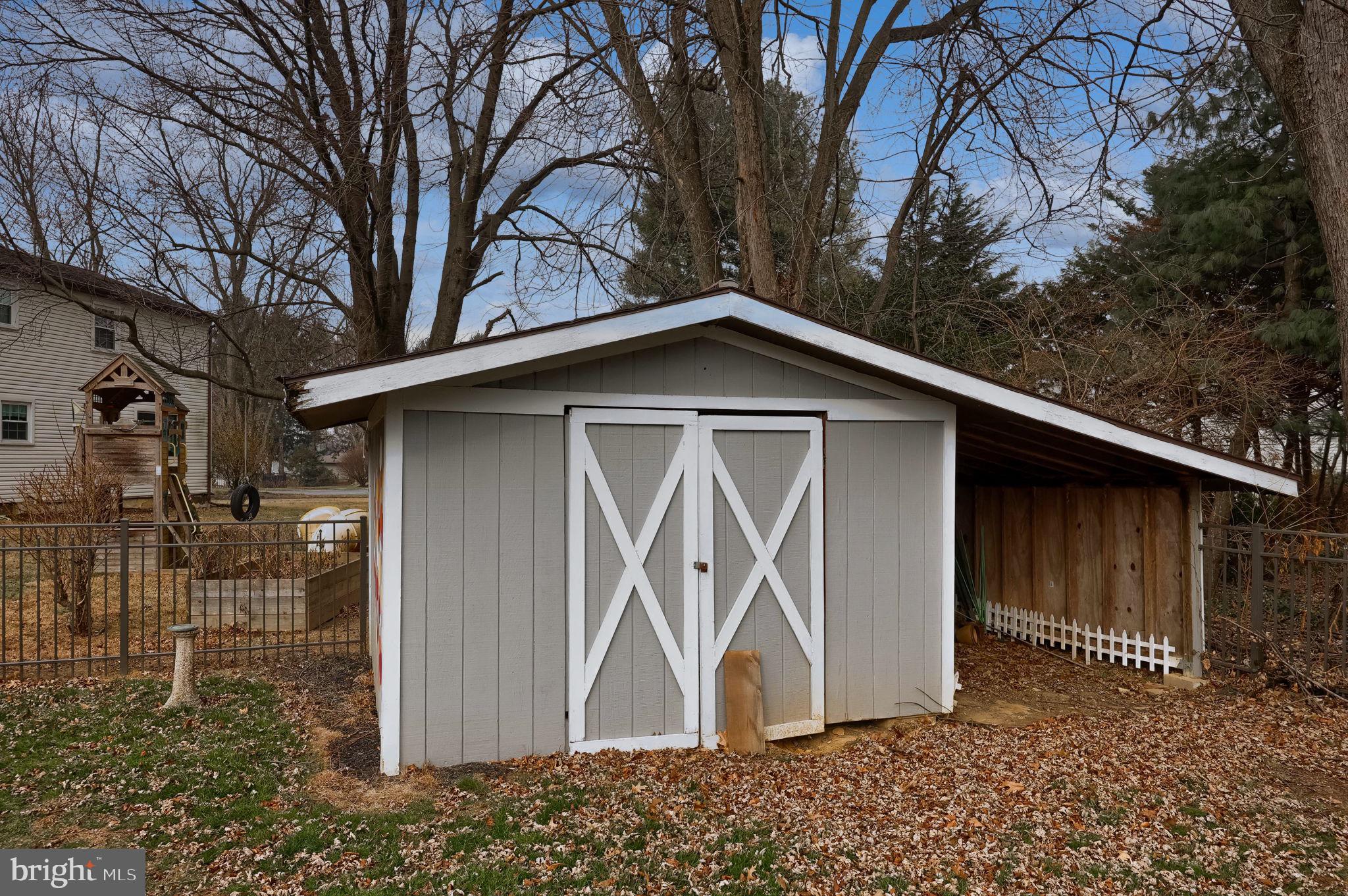 421 Longmeadow Road Lancaster, PA 17601 - Photo 39 of 44 a wooden house with trees in front of it