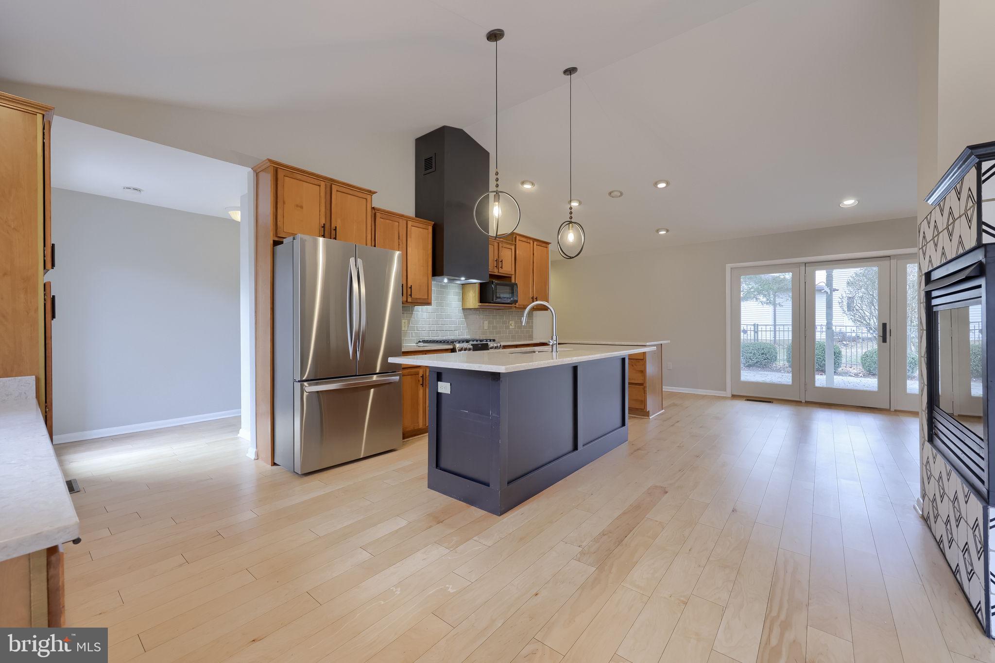 421 Longmeadow Road Lancaster, PA 17601 - Photo 8 of 44 a kitchen with stainless steel appliances a refrigerator and a wooden floor