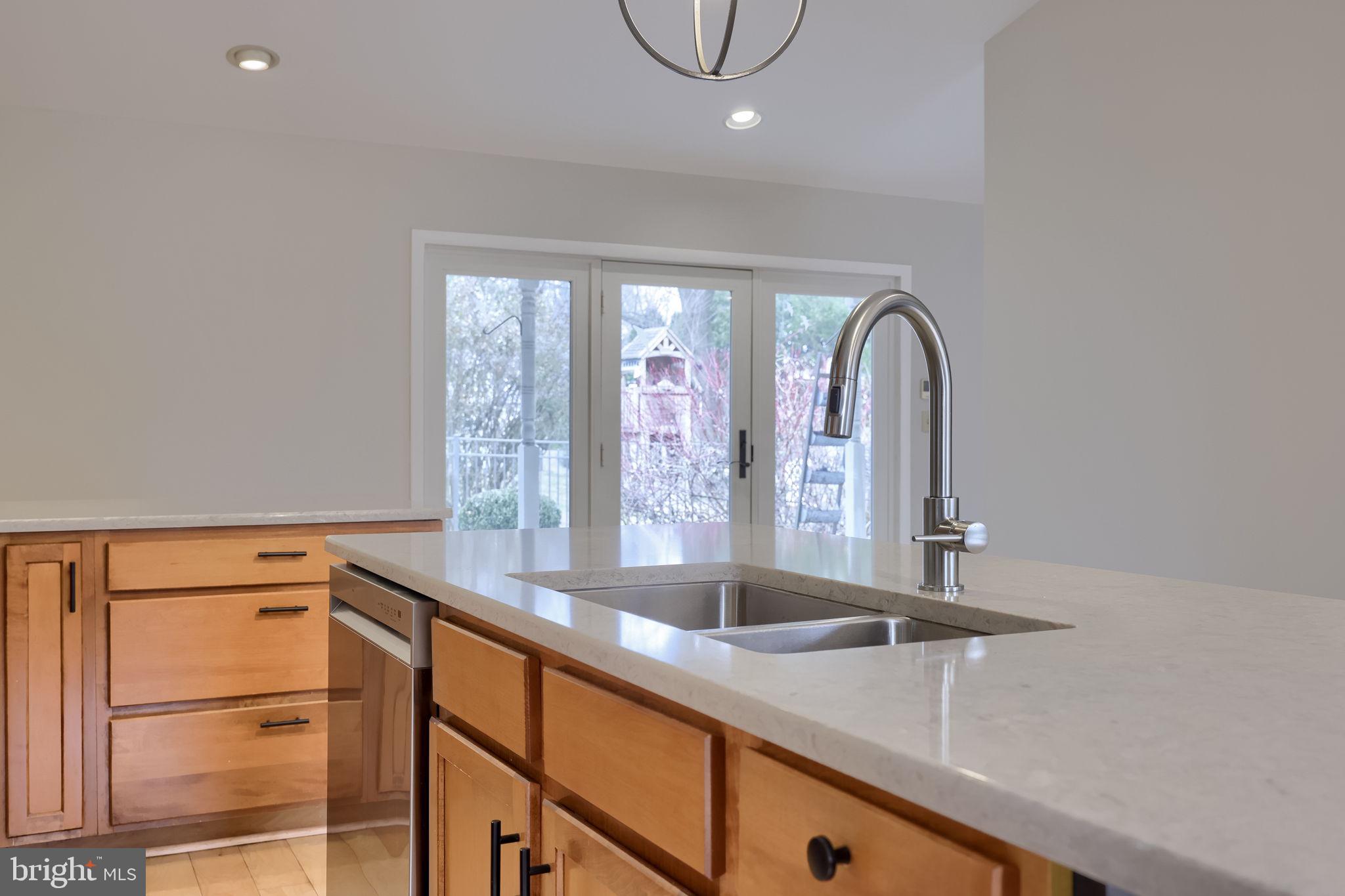 421 Longmeadow Road Lancaster, PA 17601 - Photo 10 of 44 a kitchen with stainless steel appliances granite countertop a sink and a large window