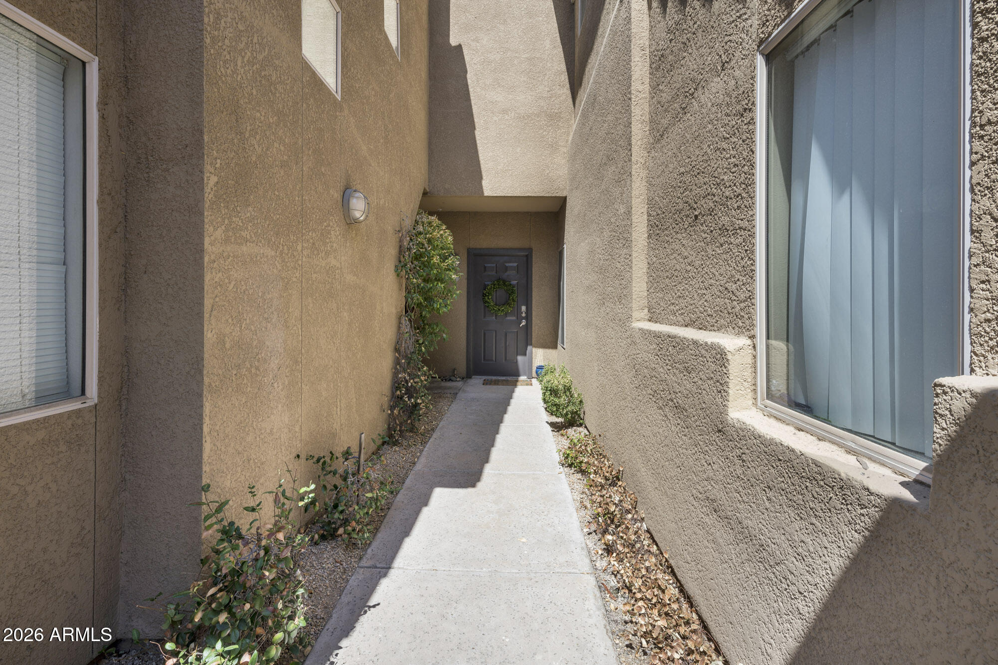 4644 North 22nd Street, Unit 1017 Phoenix, AZ 85016 - Photo 16 of 17 a view of a entryway with flower pots
