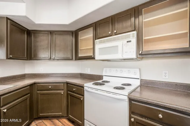 a kitchen with a cabinets and a stove top oven