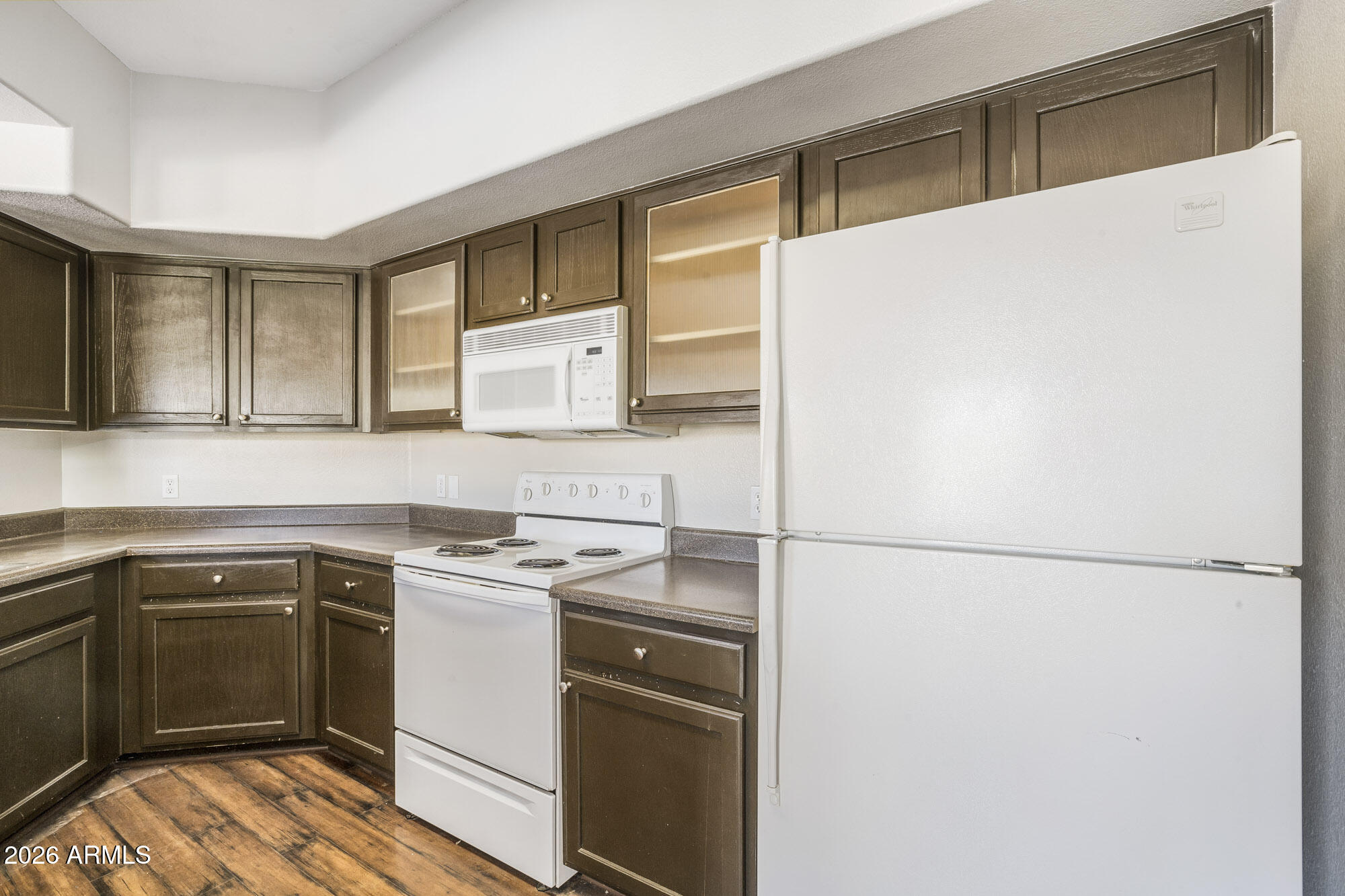 4644 North 22nd Street, Unit 1017 Phoenix, AZ 85016 - Photo 8 of 17 a kitchen with a sink a stove and refrigerator