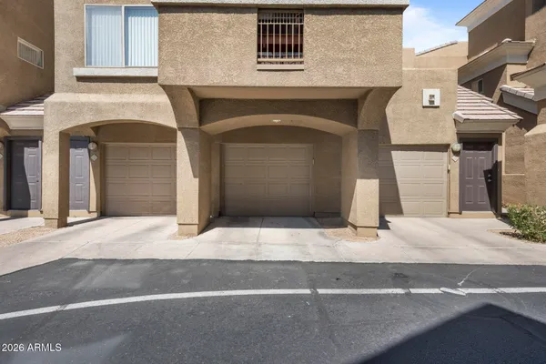 a front view of a house with garage