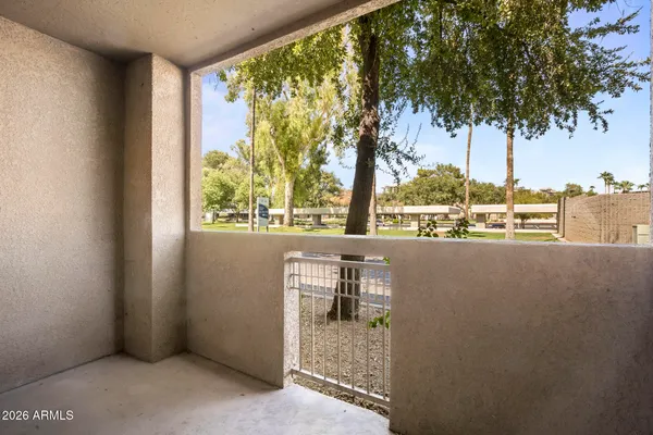 a view of balcony and a yard