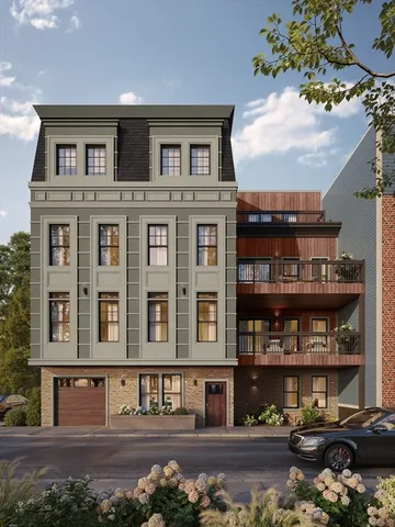 a front view of a residential apartment building with a yard