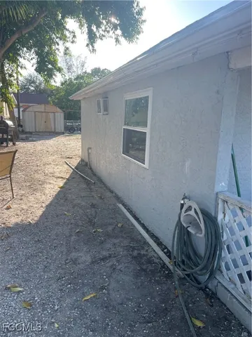 a view of a house with a backyard