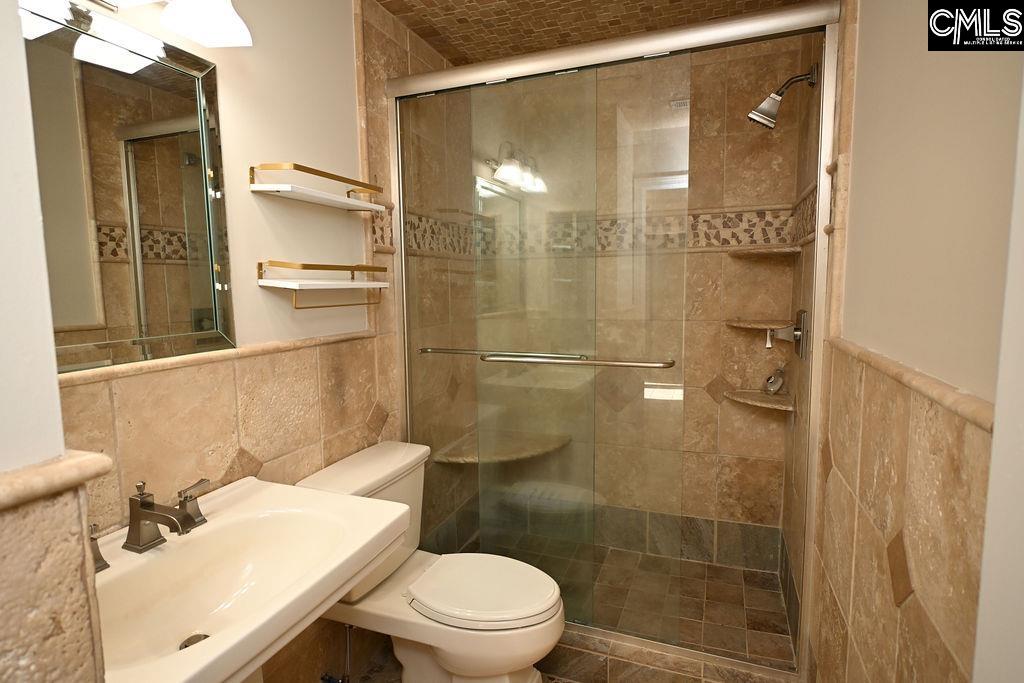 88 Running Deer Road Blythewood, SC 29016 - Photo 16 of 24 a bathroom with a shower a toilet and a sink