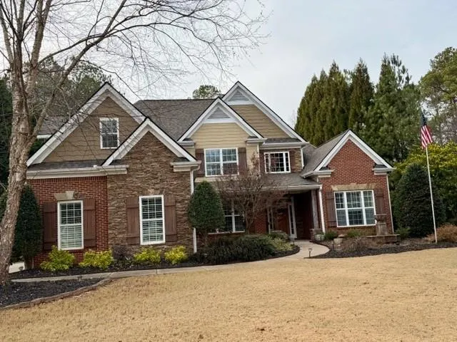 front view of a house with a yard