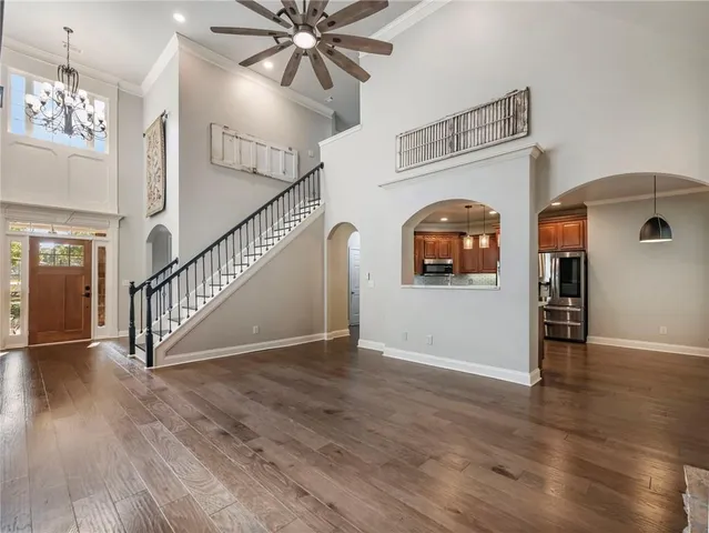 a view of a patio with table and chairs and potted plants