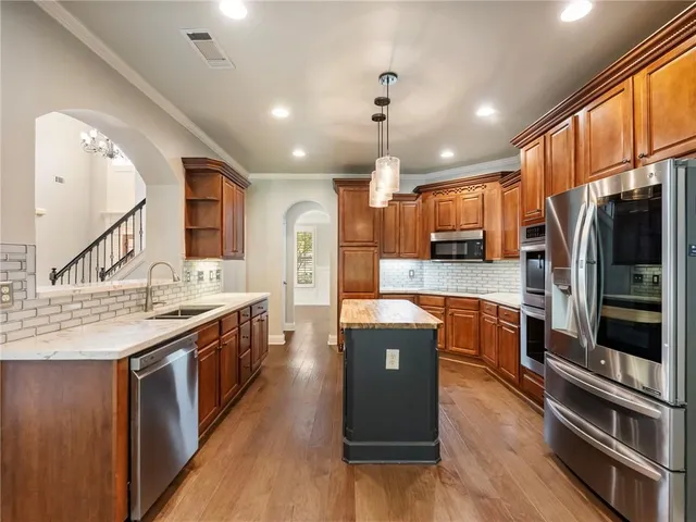 a view of yard with swimming pool and trees