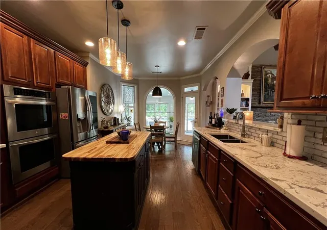 a aerial view of a house with a yard and garden