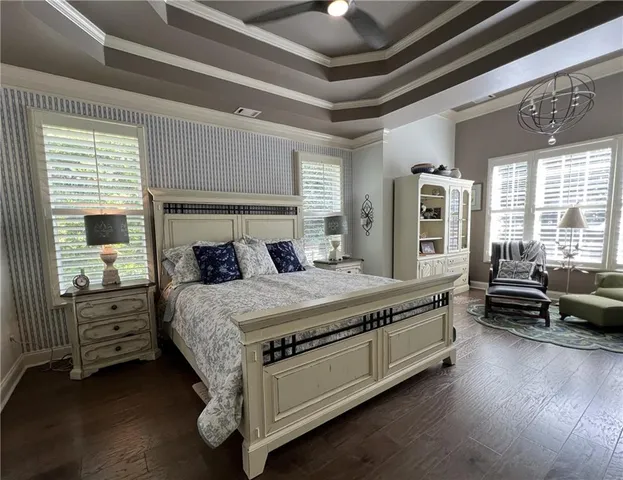 a kitchen with stainless steel appliances granite countertop a stove a sink dishwasher a refrigerator and a oven with wooden floor