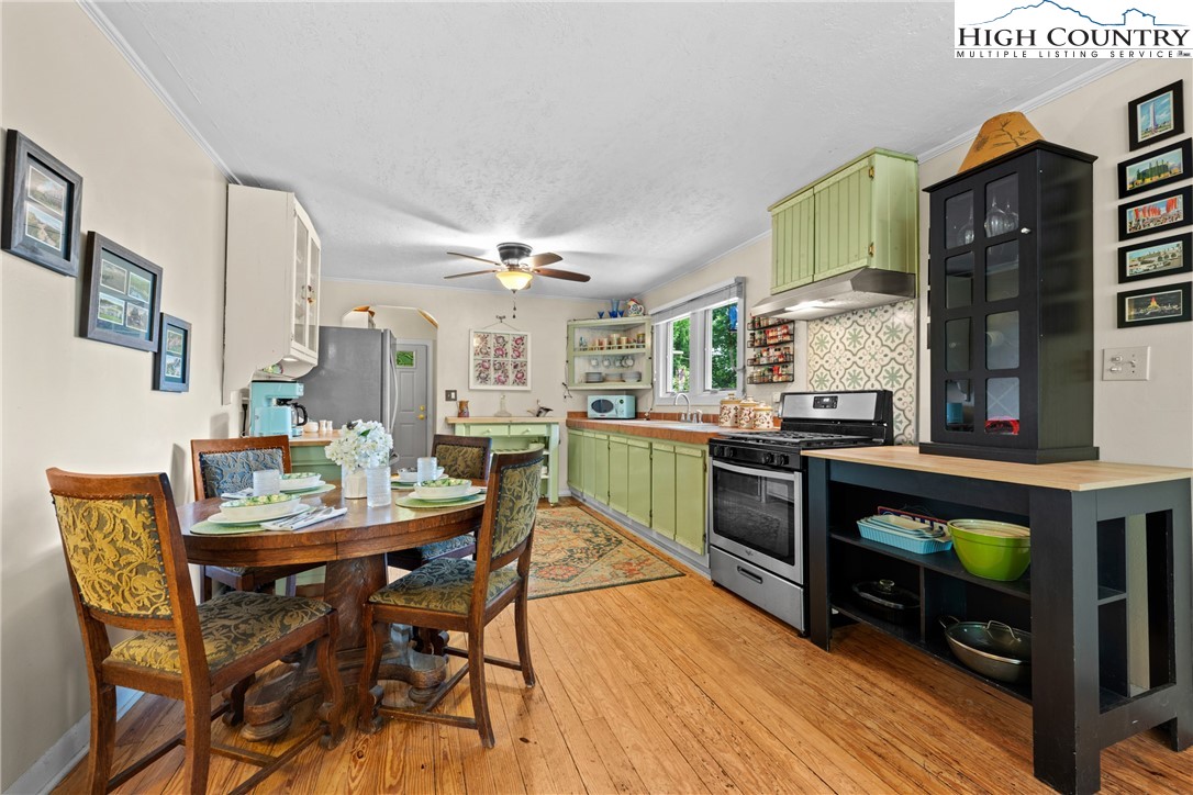 260 Sunny Acres Overlook, Unit OVERLOOK Boone, NC 28607 - Photo 12 of 28 a view of a dining room with furniture and chandelier