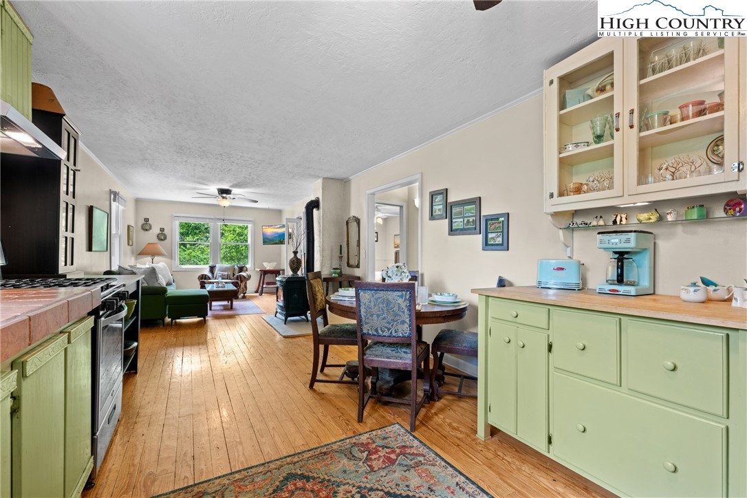 260 Sunny Acres Overlook, Unit OVERLOOK Boone, NC 28607 - Photo 13 of 28 a living room with furniture a flat screen tv and a refrigerator
