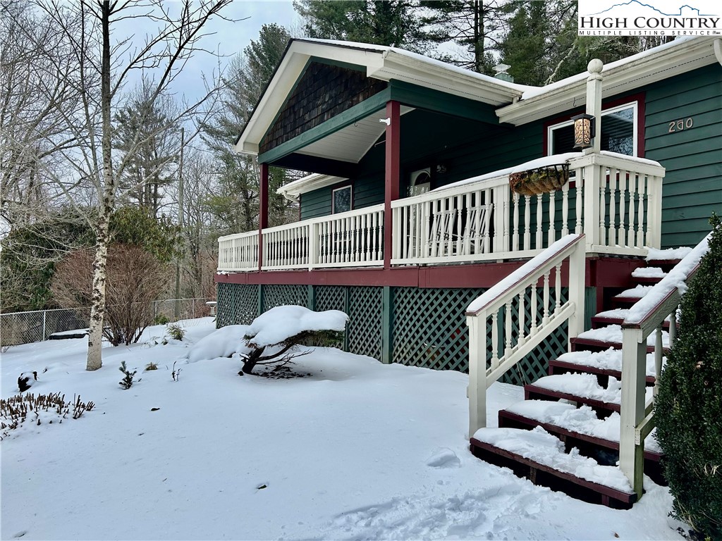 260 Sunny Acres Overlook, Unit OVERLOOK Boone, NC 28607 - Photo 2 of 28 a view of a roof deck with wooden fence