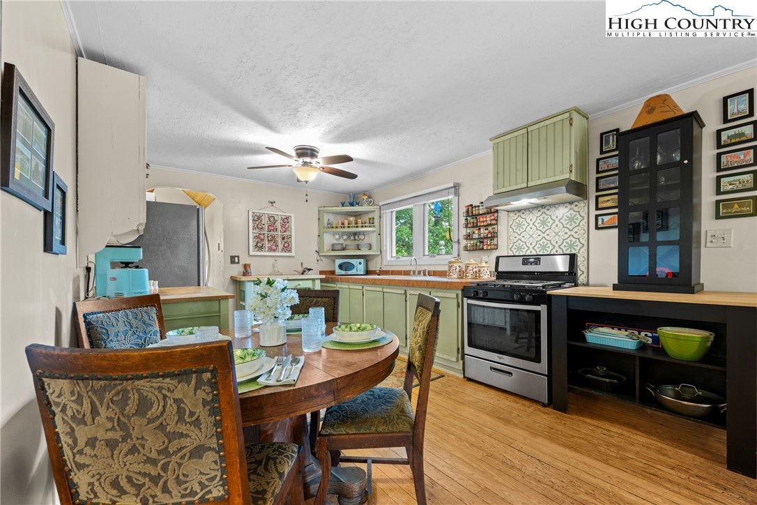 260 Sunny Acres Overlook, Unit OVERLOOK Boone, NC 28607 - Photo 9 of 28 a view of a dining room with furniture window and wooden floor