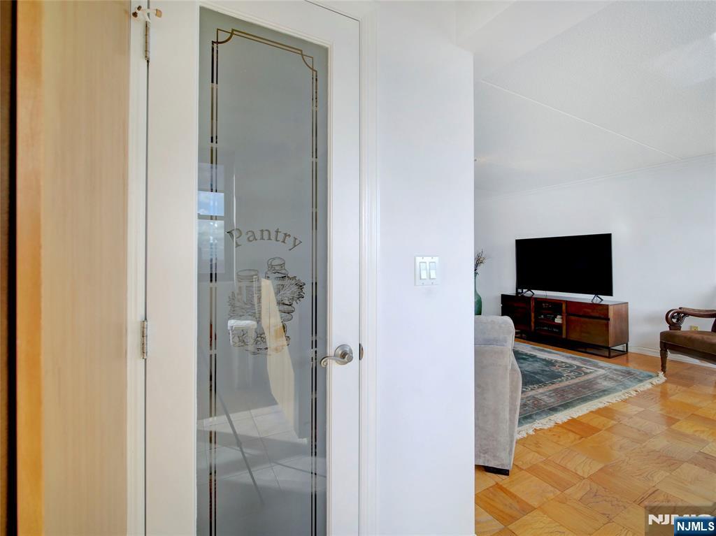 250 Gorge Road, Unit 17L Cliffside Park, NJ 07010 - Photo 9 of 30 a living room with furniture and a flat screen tv