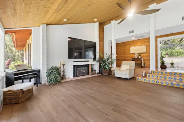 a kitchen with stainless steel appliances kitchen island granite countertop a refrigerator and a stove