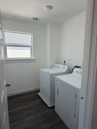 a utility room with dryer and washer