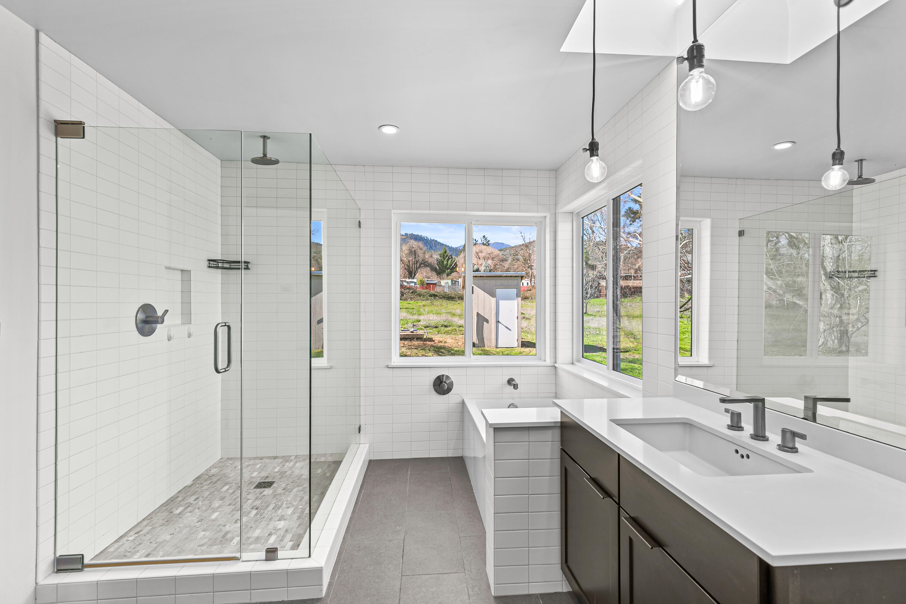 593 Crowson Road Ashland, OR 97520 - Photo 14 of 36 a bathroom with a sink a toilet a tub and shower