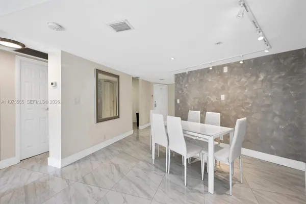 a view of a dining room with furniture