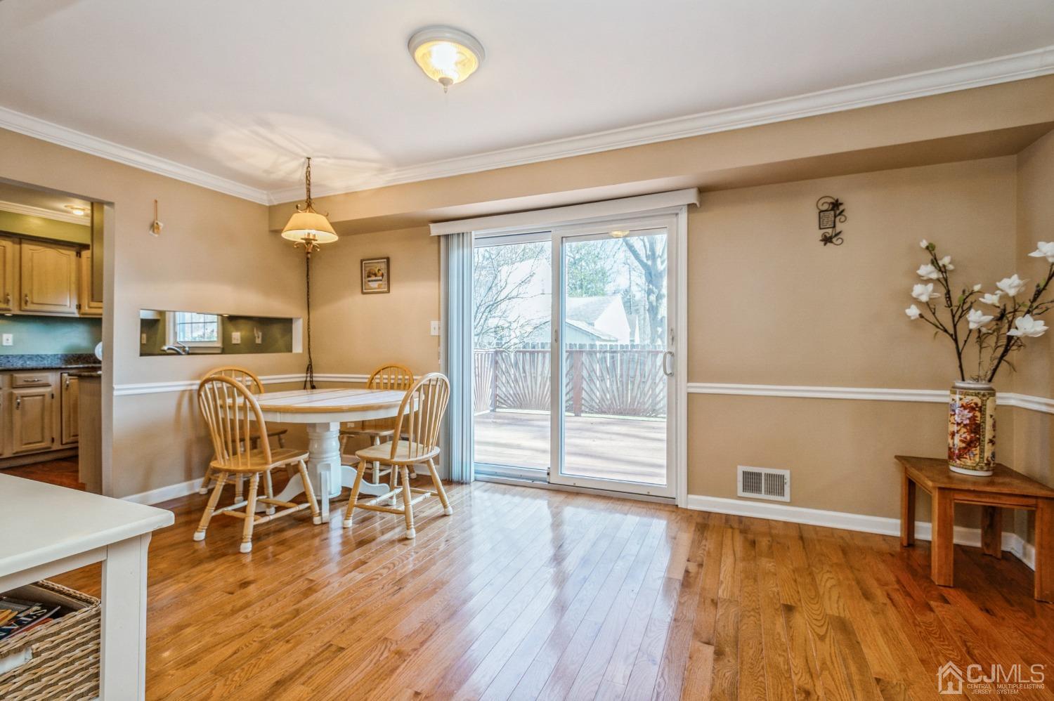 421 Sherman Road North Brunswick, NJ 08902 - Photo 9 of 20 Nicely arranged family room with sliders to large deck