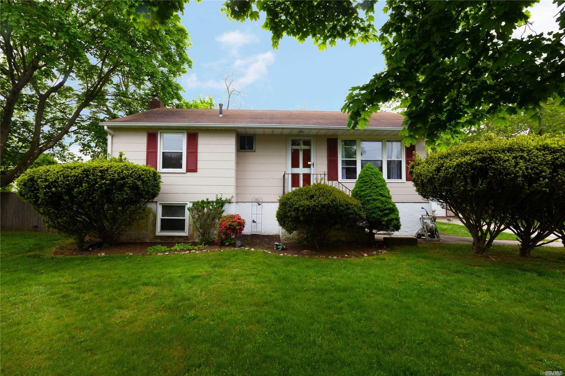 a view of a house with a yard porch and sitting area