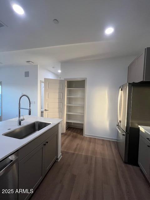 1225 North Arizona Avenue, Unit A4 Gilbert, AZ 85233 - Photo 5 of 23 a kitchen with sink refrigerator and cabinets