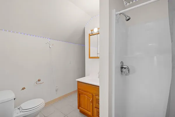a bed room with a bed and a large mirror