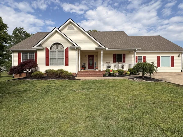 a front view of a house with a yard