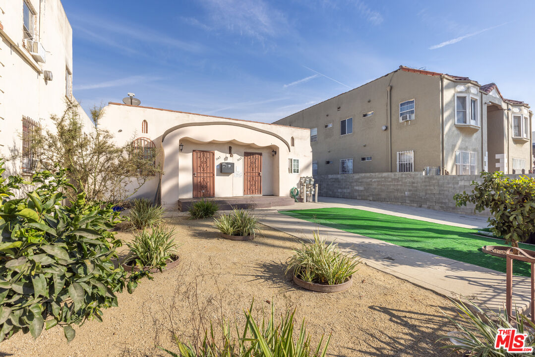 1045 Browning Boulevard Los Angeles, CA 90037 - Photo 2 of 15 a front view of a house with a yard