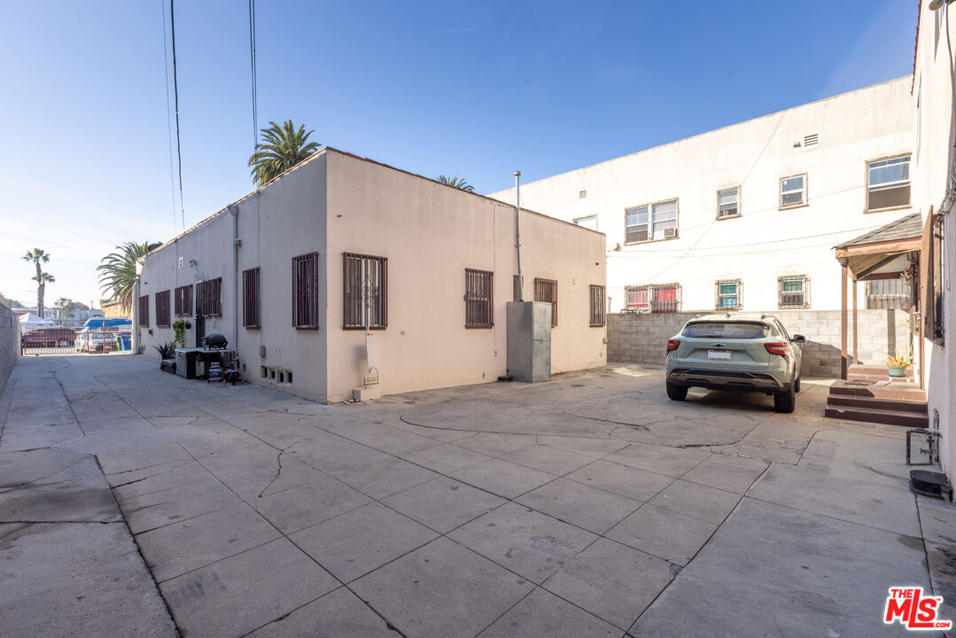 1045 Browning Boulevard Los Angeles, CA 90037 - Photo 5 of 15 a view of a cars park in front of house