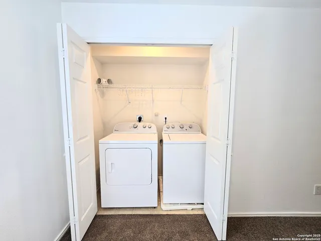a utility room with dryer and washer