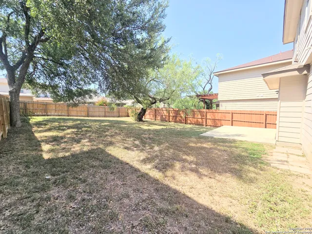 a view of back yard of the house