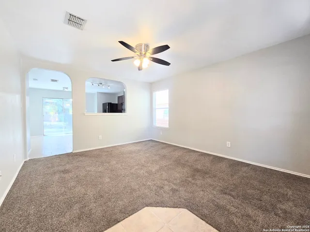 a view of a big room with carpet