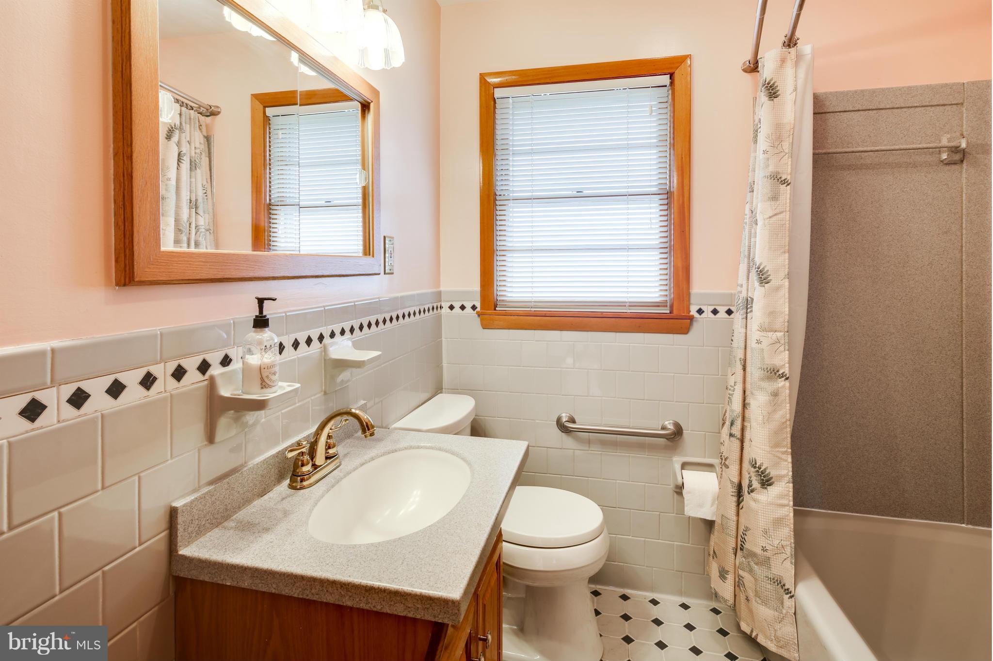 700 East Maple Road Linthicum, MD 21090 - Photo 12 of 29 a bathroom with a sink toilet and shower