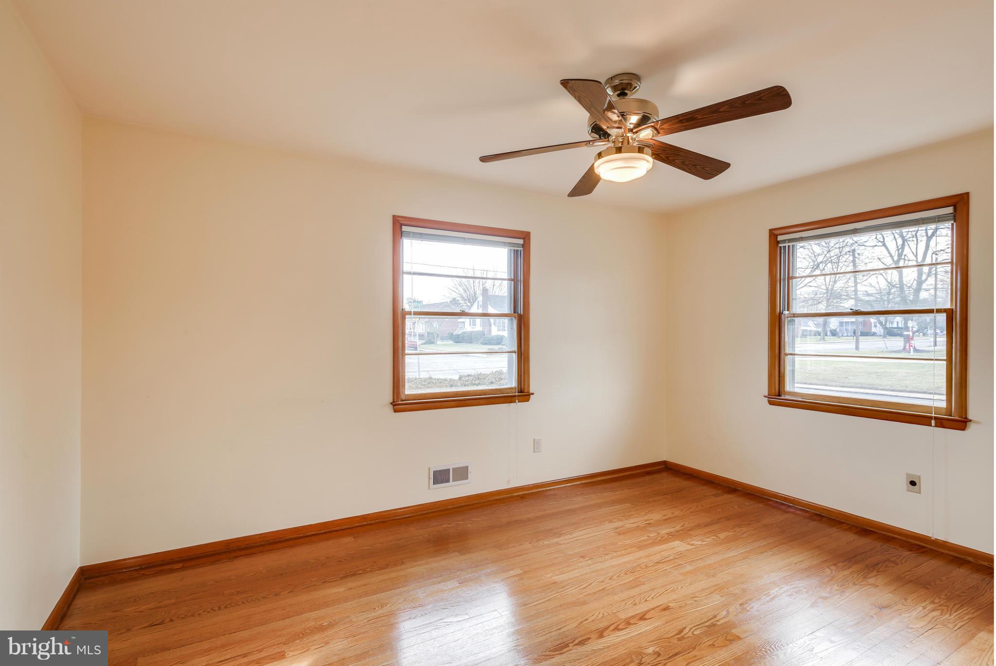 700 East Maple Road Linthicum, MD 21090 - Photo 13 of 29 a view of empty room with wooden floor and fan