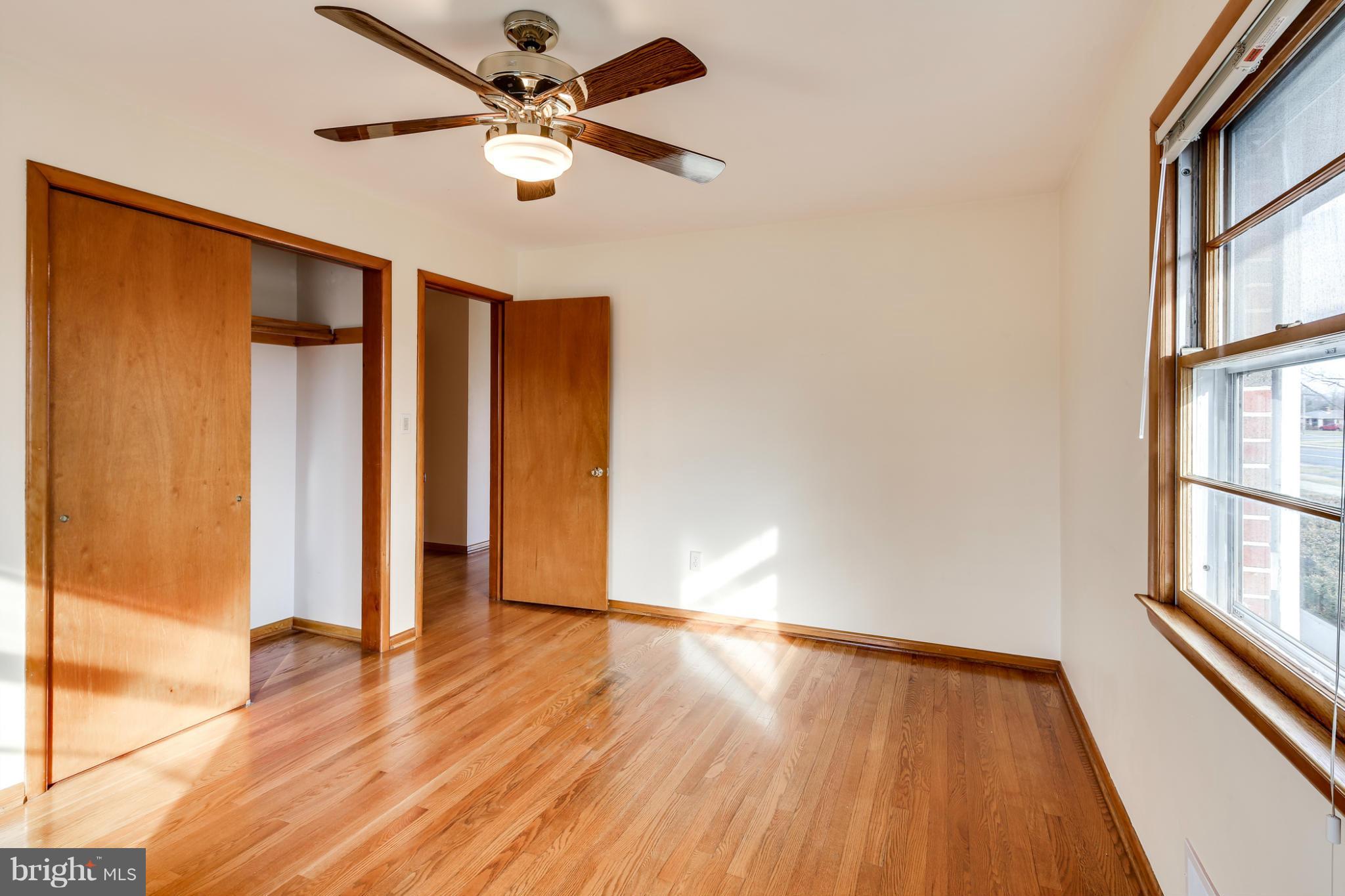 700 East Maple Road Linthicum, MD 21090 - Photo 14 of 29 wooden floor in an empty room with a window