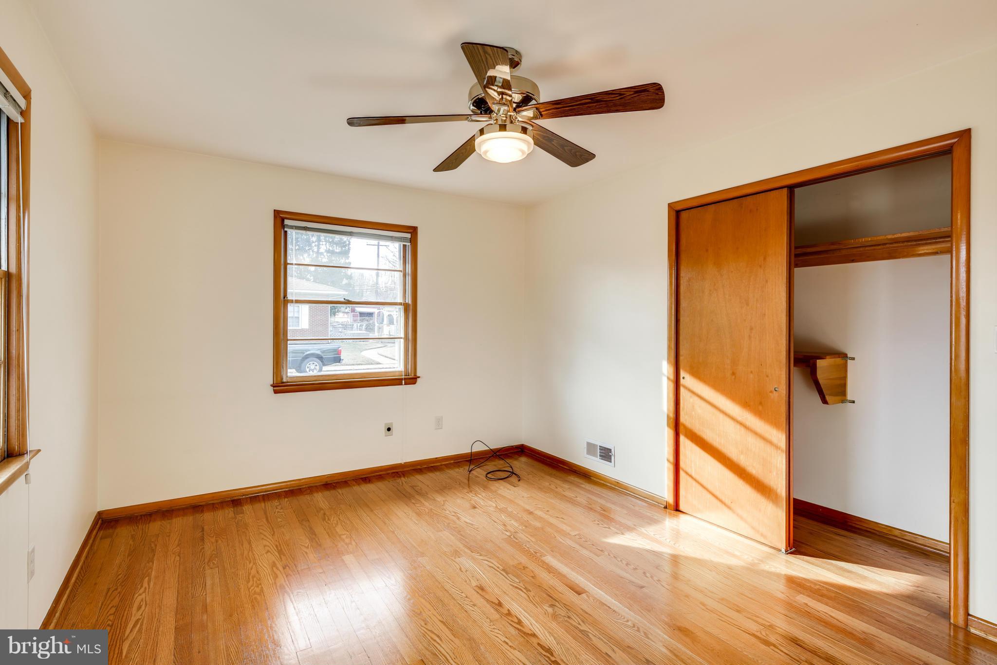 700 East Maple Road Linthicum, MD 21090 - Photo 15 of 29 a view of empty room with wooden floor and fan
