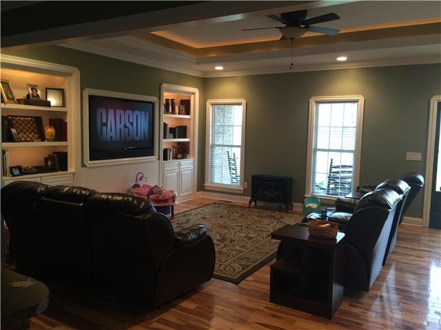 1041 Long Shot Drive Springfield, TN 37172 - Photo 5 of 18 HARDWOOD IN LIVING ROOM WITH TRAY CEILING AND BUILT IN BOOKSHELVES