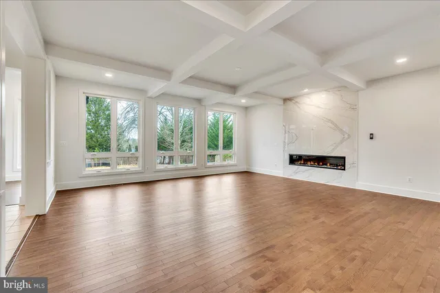 a view of a kitchen with a sink and a large window