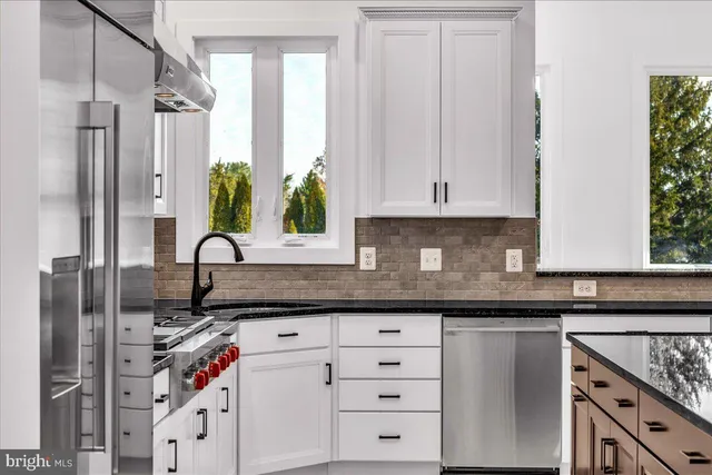 a view of a kitchen cabinets and stainless steel appliances