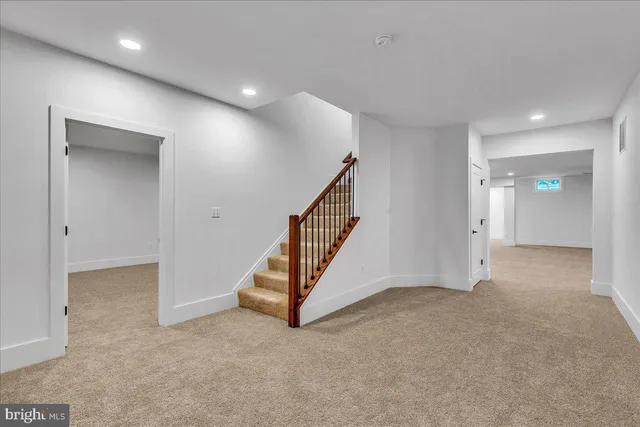 a view of an empty room and a window