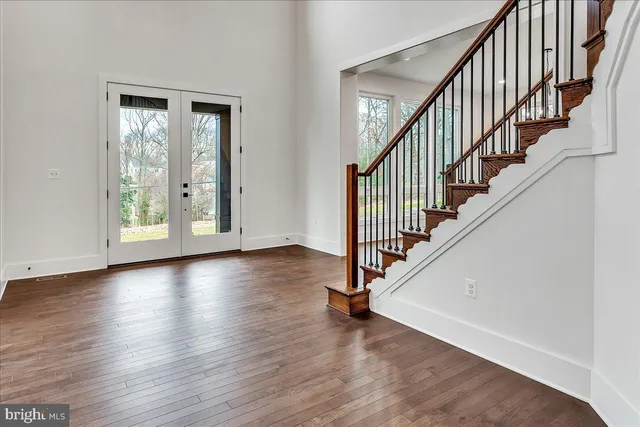 a view of an entryway with wooden floor