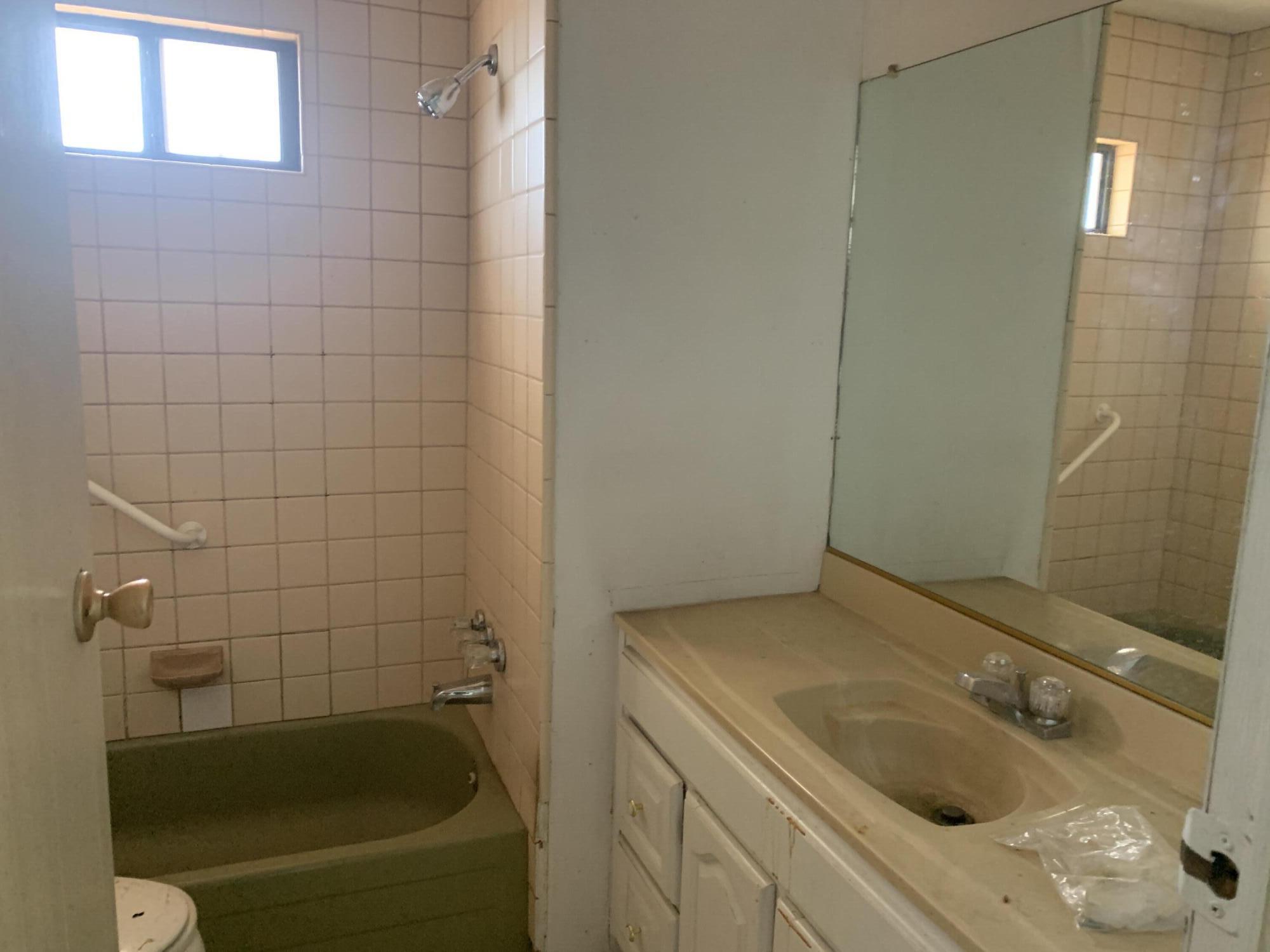 69430 Fairway Road Desert Hot Springs, CA 92241 - Photo 20 of 21 a bathroom with a tub a sink and a shower