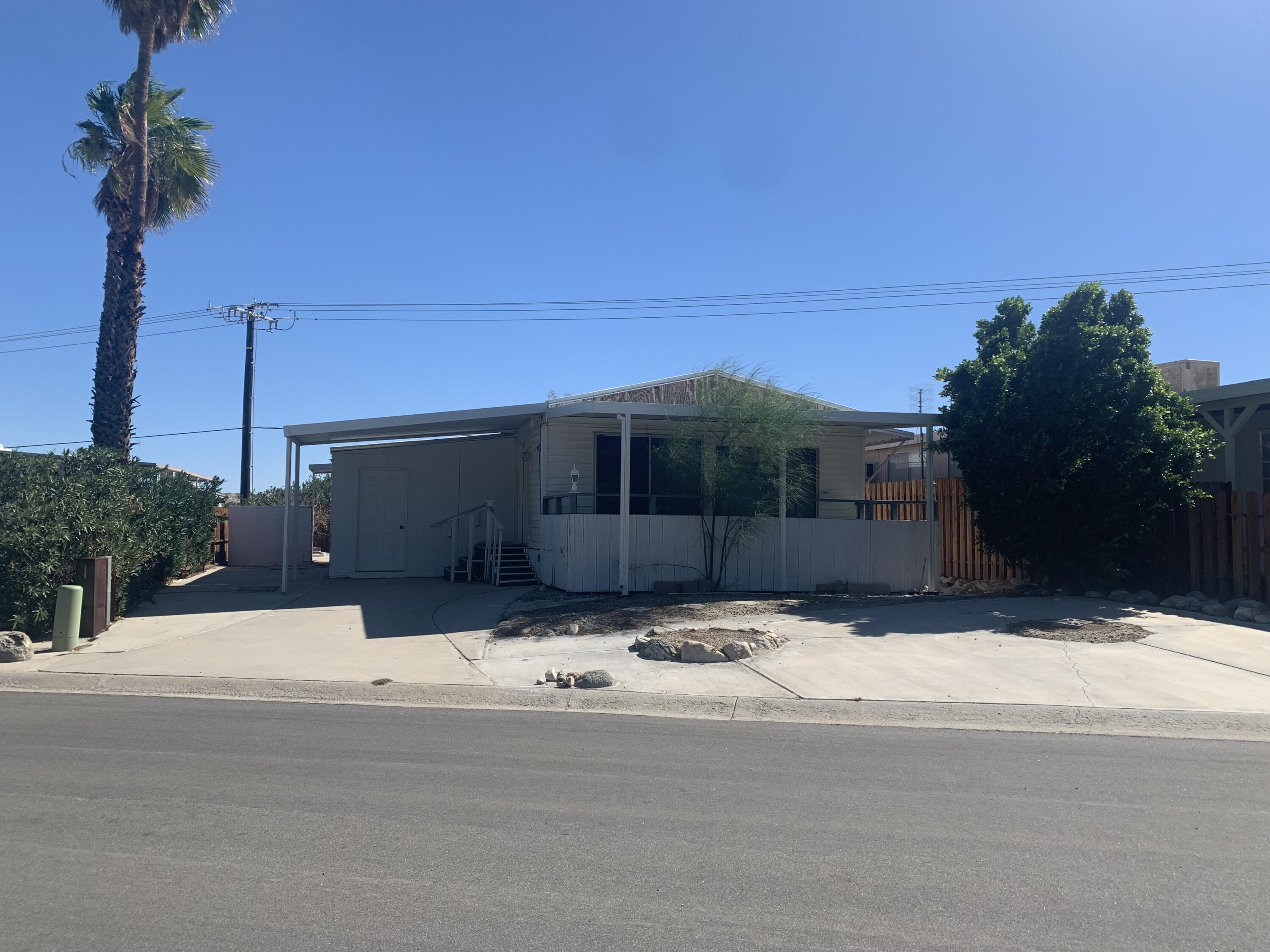 69430 Fairway Road Desert Hot Springs, CA 92241 - Photo 3 of 21 a outdoor view of house with a street
