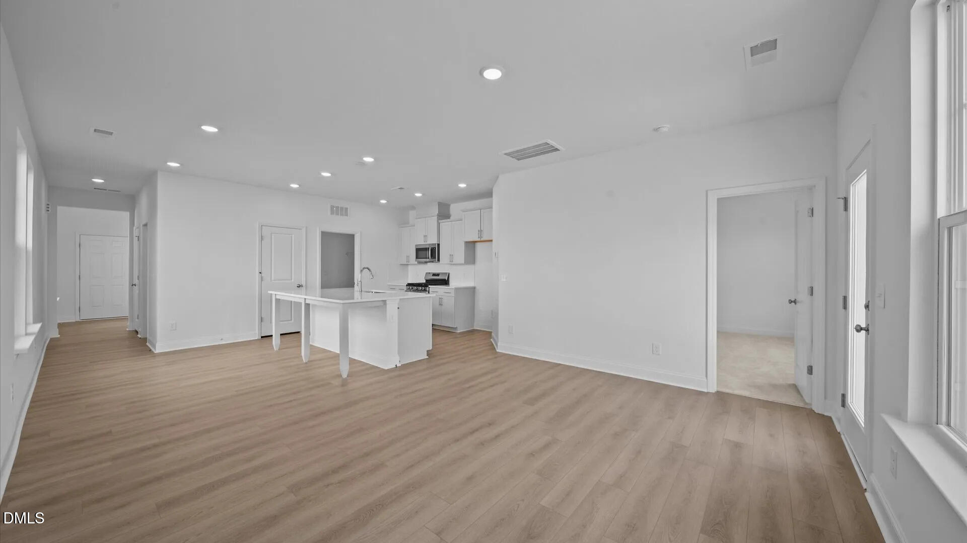 23 Gerrad Street, Unit 68 Franklinton, NC 27525 - Photo 11 of 23 a view of kitchen with kitchen island wooden floors appliances and cabinets