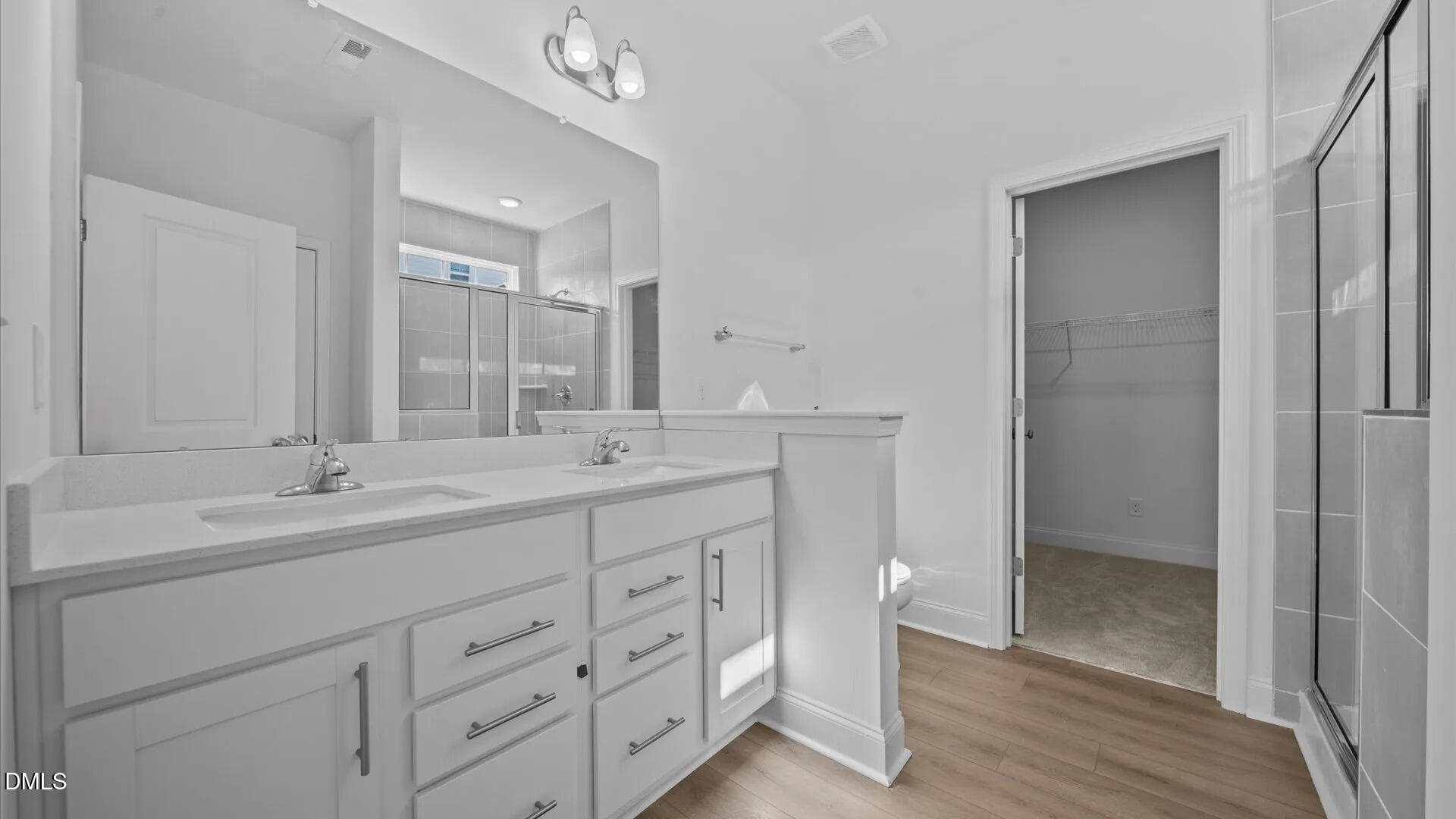 23 Gerrad Street, Unit 68 Franklinton, NC 27525 - Photo 16 of 23 a bathroom with double sink and a mirror