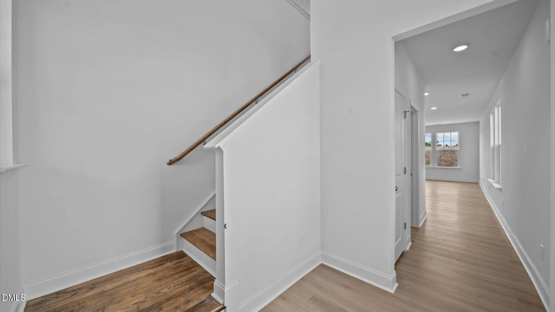 23 Gerrad Street, Unit 68 Franklinton, NC 27525 - Photo 3 of 23 a view of hallway with stairs and wooden floor